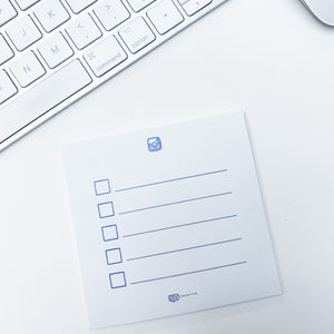 Open image in slideshow, A Social Strategy Sticky Notes with checkboxes on a white desk next to a white computer keyboard. The paper features a logo at the top left corner.
